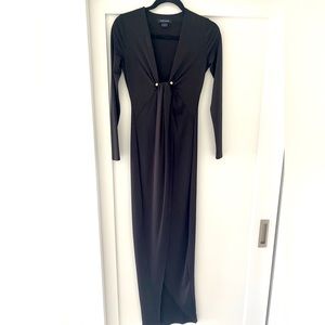 Marciano black long sleeve dress. Front slit & gold pendant closure.